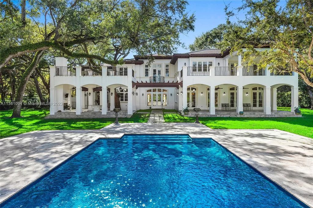 This stunning palatial Neoclassical estate in Coral Gables is the perfect entertainer's dream, with an enormous entertainment wing, movie theater, private guest suite, and resort-style amenities. The 4000sf master wing features a gym, dual closets, luxurious bathroom, large sitting room/office, and expansive terraces. Also includes separate staff/in-law quarters, oversized garages for 6 cars, and access to a 40ft boat slip in Snapper Creek Marina.