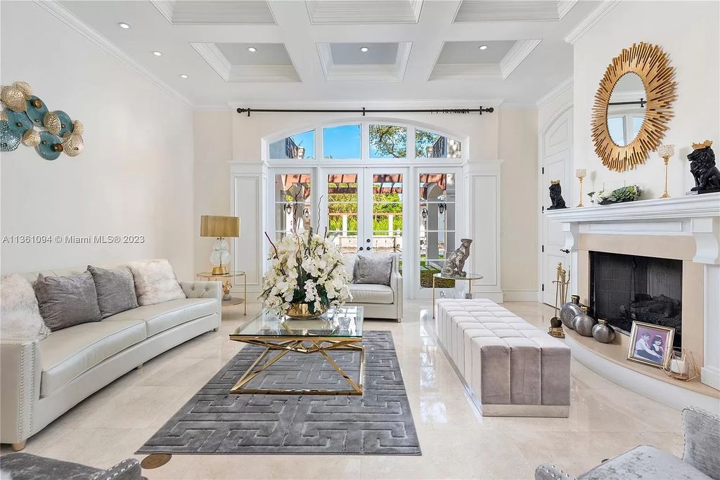 This stunning palatial Neoclassical estate in Coral Gables is the perfect entertainer's dream, with an enormous entertainment wing, movie theater, private guest suite, and resort-style amenities. The 4000sf master wing features a gym, dual closets, luxurious bathroom, large sitting room/office, and expansive terraces. Also includes separate staff/in-law quarters, oversized garages for 6 cars, and access to a 40ft boat slip in Snapper Creek Marina.