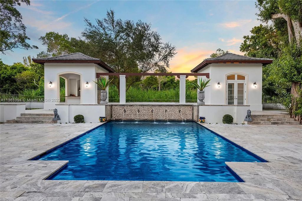 This stunning palatial Neoclassical estate in Coral Gables is the perfect entertainer's dream, with an enormous entertainment wing, movie theater, private guest suite, and resort-style amenities. The 4000sf master wing features a gym, dual closets, luxurious bathroom, large sitting room/office, and expansive terraces. Also includes separate staff/in-law quarters, oversized garages for 6 cars, and access to a 40ft boat slip in Snapper Creek Marina.