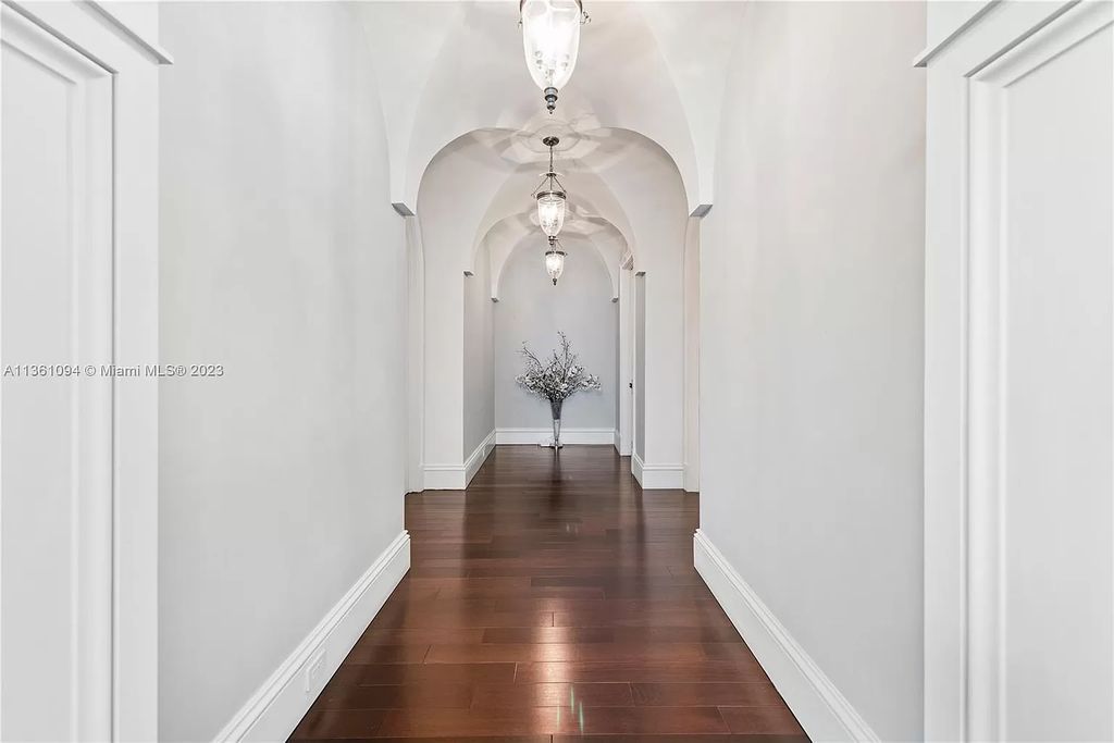 This stunning palatial Neoclassical estate in Coral Gables is the perfect entertainer's dream, with an enormous entertainment wing, movie theater, private guest suite, and resort-style amenities. The 4000sf master wing features a gym, dual closets, luxurious bathroom, large sitting room/office, and expansive terraces. Also includes separate staff/in-law quarters, oversized garages for 6 cars, and access to a 40ft boat slip in Snapper Creek Marina.