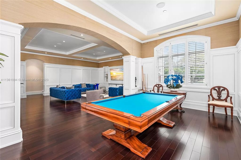 This stunning palatial Neoclassical estate in Coral Gables is the perfect entertainer's dream, with an enormous entertainment wing, movie theater, private guest suite, and resort-style amenities. The 4000sf master wing features a gym, dual closets, luxurious bathroom, large sitting room/office, and expansive terraces. Also includes separate staff/in-law quarters, oversized garages for 6 cars, and access to a 40ft boat slip in Snapper Creek Marina.