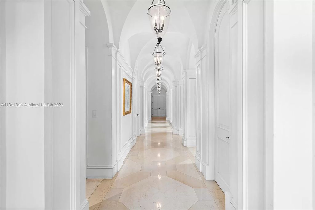 This stunning palatial Neoclassical estate in Coral Gables is the perfect entertainer's dream, with an enormous entertainment wing, movie theater, private guest suite, and resort-style amenities. The 4000sf master wing features a gym, dual closets, luxurious bathroom, large sitting room/office, and expansive terraces. Also includes separate staff/in-law quarters, oversized garages for 6 cars, and access to a 40ft boat slip in Snapper Creek Marina.