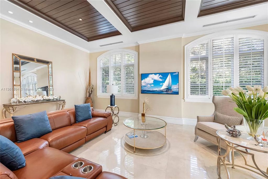 This stunning palatial Neoclassical estate in Coral Gables is the perfect entertainer's dream, with an enormous entertainment wing, movie theater, private guest suite, and resort-style amenities. The 4000sf master wing features a gym, dual closets, luxurious bathroom, large sitting room/office, and expansive terraces. Also includes separate staff/in-law quarters, oversized garages for 6 cars, and access to a 40ft boat slip in Snapper Creek Marina.