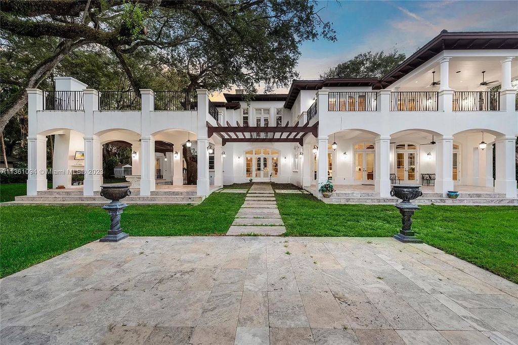 This stunning palatial Neoclassical estate in Coral Gables is the perfect entertainer's dream, with an enormous entertainment wing, movie theater, private guest suite, and resort-style amenities. The 4000sf master wing features a gym, dual closets, luxurious bathroom, large sitting room/office, and expansive terraces. Also includes separate staff/in-law quarters, oversized garages for 6 cars, and access to a 40ft boat slip in Snapper Creek Marina.