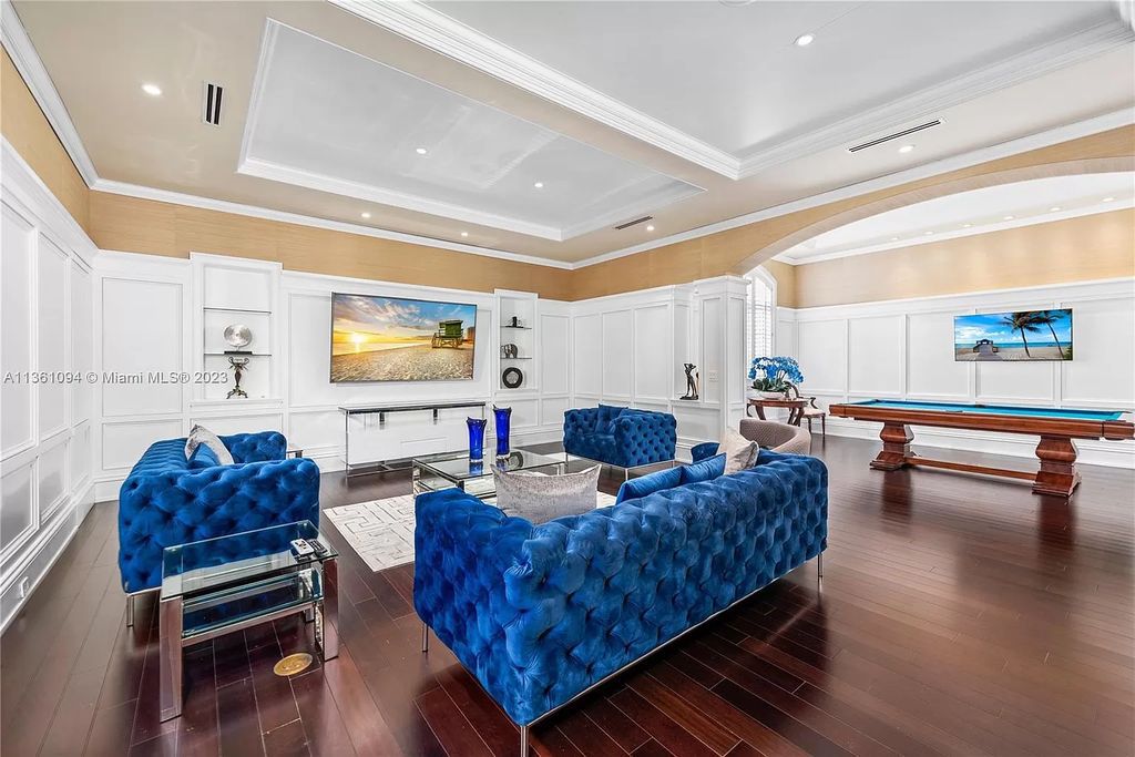 This stunning palatial Neoclassical estate in Coral Gables is the perfect entertainer's dream, with an enormous entertainment wing, movie theater, private guest suite, and resort-style amenities. The 4000sf master wing features a gym, dual closets, luxurious bathroom, large sitting room/office, and expansive terraces. Also includes separate staff/in-law quarters, oversized garages for 6 cars, and access to a 40ft boat slip in Snapper Creek Marina.