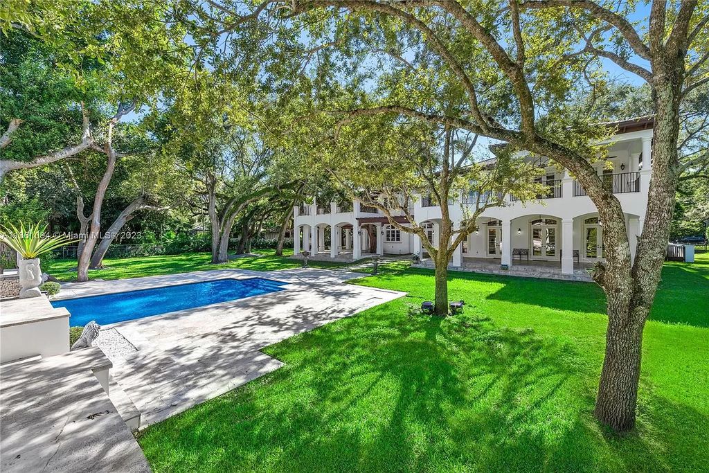 This stunning palatial Neoclassical estate in Coral Gables is the perfect entertainer's dream, with an enormous entertainment wing, movie theater, private guest suite, and resort-style amenities. The 4000sf master wing features a gym, dual closets, luxurious bathroom, large sitting room/office, and expansive terraces. Also includes separate staff/in-law quarters, oversized garages for 6 cars, and access to a 40ft boat slip in Snapper Creek Marina.