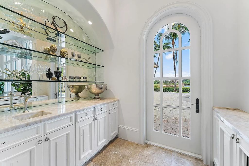 Boasting the finest views in Old Palm, this 6-bedroom, 8.5-bathroom estate offers complete privacy and an entertainer's dream kitchen. With all new French Oak floors, light fixtures, bathrooms, and more, this home is truly the best of the best!