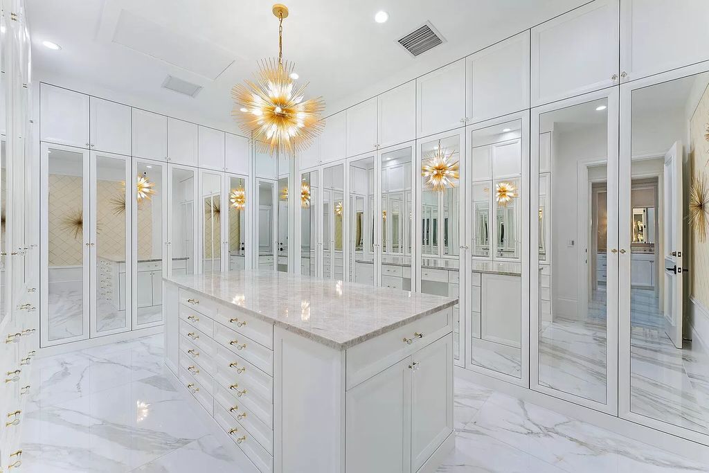 Boasting the finest views in Old Palm, this 6-bedroom, 8.5-bathroom estate offers complete privacy and an entertainer's dream kitchen. With all new French Oak floors, light fixtures, bathrooms, and more, this home is truly the best of the best!