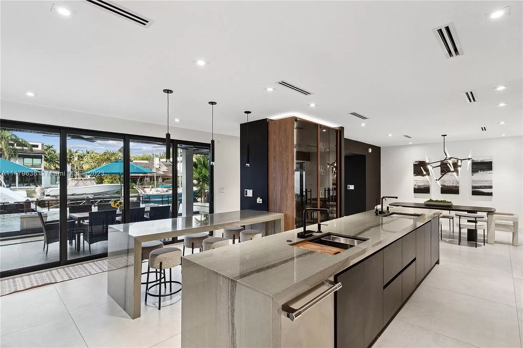 Experience the epitome of luxury living in this newly completed 8-bedroom waterfront masterpiece in Gables by the Sea. With fluid modern design, exquisite craftsmanship, and lavish amenities, this stunning residence offers an unparalleled lifestyle of elegance and sophistication.