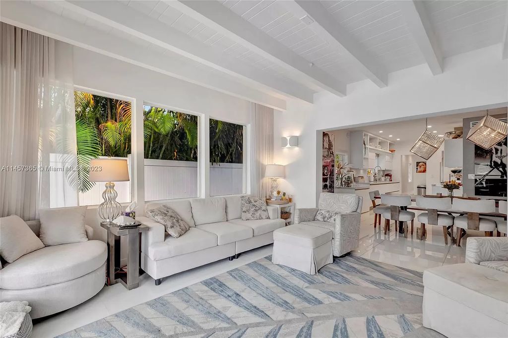 This completely renovated Venetian Island waterfront home offers immaculate views of the Port of Miami, Brickell, Downtown, and Edgewater. With 4 bedrooms and 4 full bathrooms, the master suite is the perfect place to relax and unwind. The backyard has been transformed with a full summer kitchen, outdoor shower, and dock, making this home perfect for entertaining or enjoying the Miami Beach lifestyle.