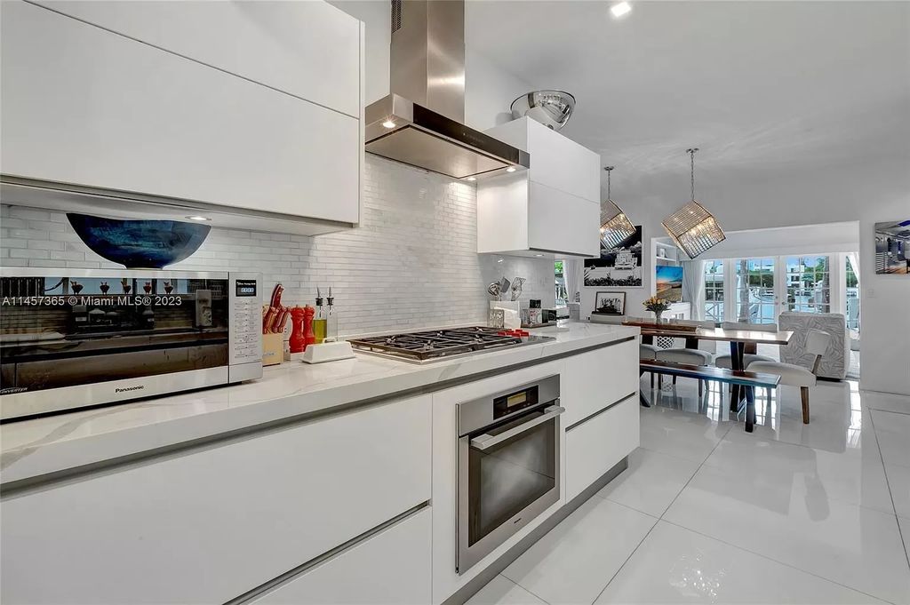 This completely renovated Venetian Island waterfront home offers immaculate views of the Port of Miami, Brickell, Downtown, and Edgewater. With 4 bedrooms and 4 full bathrooms, the master suite is the perfect place to relax and unwind. The backyard has been transformed with a full summer kitchen, outdoor shower, and dock, making this home perfect for entertaining or enjoying the Miami Beach lifestyle.