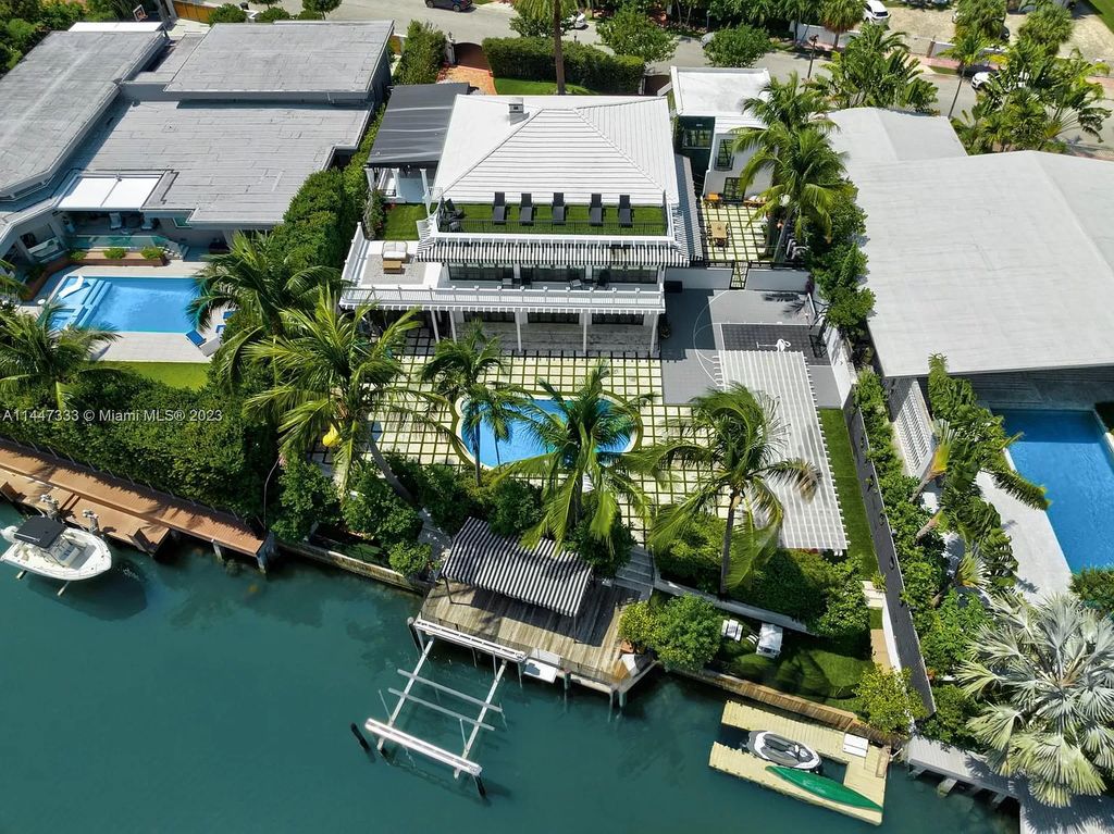 Discover this exquisite waterfront haven on Flamingo Drive, where timeless elegance meets modern luxury. Recently renovated to perfection, this spacious residence boasts an array of sophisticated features, including an oversized primary retreat, a heated saltwater pool, and a private dock. Experience resort-style living just minutes from the ocean, Sunset Harbour, and all that Miami Beach has to offer.