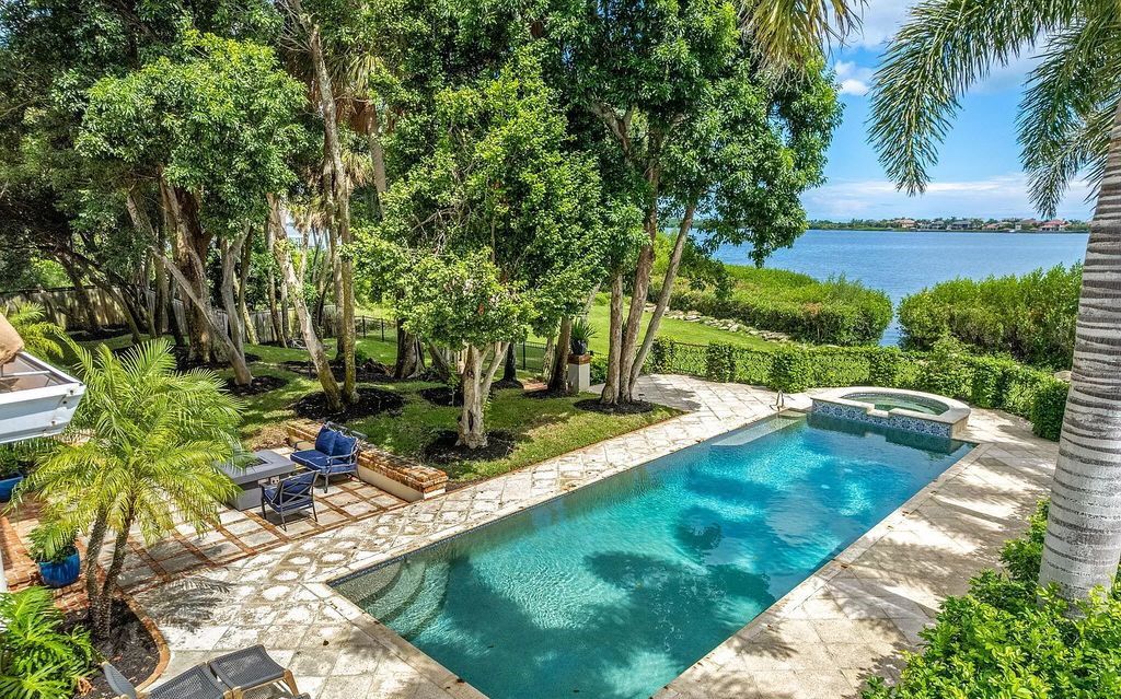 Escape to your own private paradise in this 5-bedroom waterfront retreat on S Tropical Trail. Nestled on 1.04 acres, this stunning home offers modern amenities, breathtaking views, and a tranquil oasis to call your own.