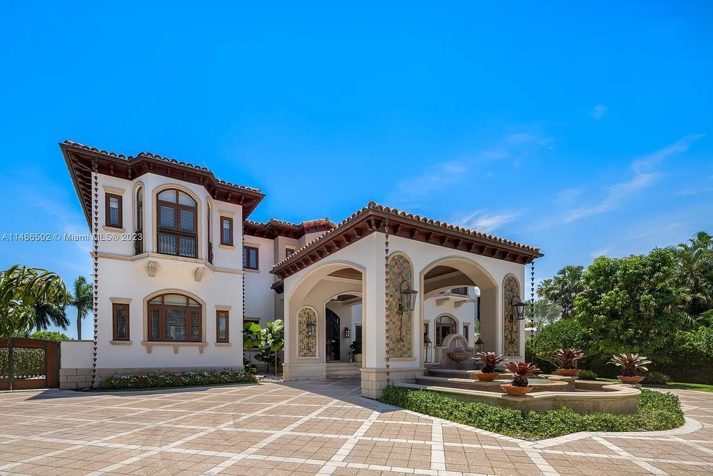 Live a life of unparalleled luxury on Palm Island. This 3-home estate boasts soaring ceilings, expansive living areas, and stunning water views. Perfect for entertaining, it features outdoor kitchens, covered lounges, and breathtaking vistas of downtown Miami. A truly unique opportunity for discerning buyers.