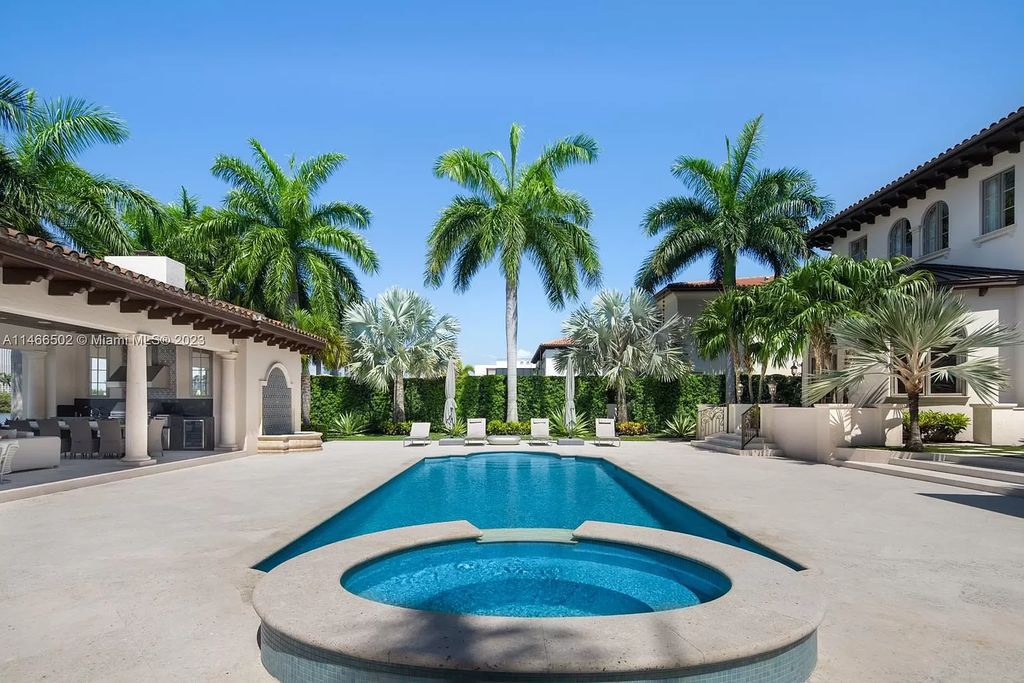 Live a life of unparalleled luxury on Palm Island. This 3-home estate boasts soaring ceilings, expansive living areas, and stunning water views. Perfect for entertaining, it features outdoor kitchens, covered lounges, and breathtaking vistas of downtown Miami. A truly unique opportunity for discerning buyers.