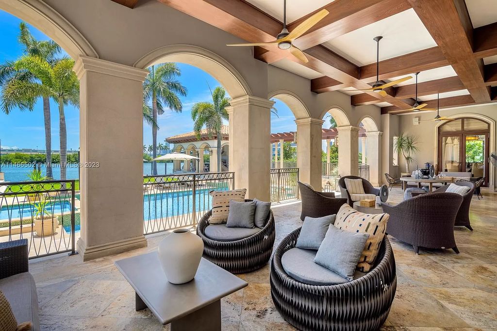 Live a life of unparalleled luxury on Palm Island. This 3-home estate boasts soaring ceilings, expansive living areas, and stunning water views. Perfect for entertaining, it features outdoor kitchens, covered lounges, and breathtaking vistas of downtown Miami. A truly unique opportunity for discerning buyers.