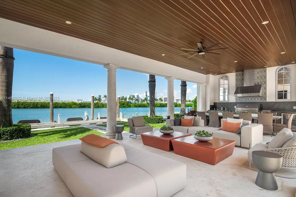 Live a life of unparalleled luxury on Palm Island. This 3-home estate boasts soaring ceilings, expansive living areas, and stunning water views. Perfect for entertaining, it features outdoor kitchens, covered lounges, and breathtaking vistas of downtown Miami. A truly unique opportunity for discerning buyers.