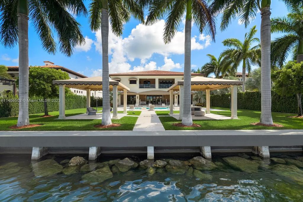 Live a life of unparalleled luxury on Palm Island. This 3-home estate boasts soaring ceilings, expansive living areas, and stunning water views. Perfect for entertaining, it features outdoor kitchens, covered lounges, and breathtaking vistas of downtown Miami. A truly unique opportunity for discerning buyers.