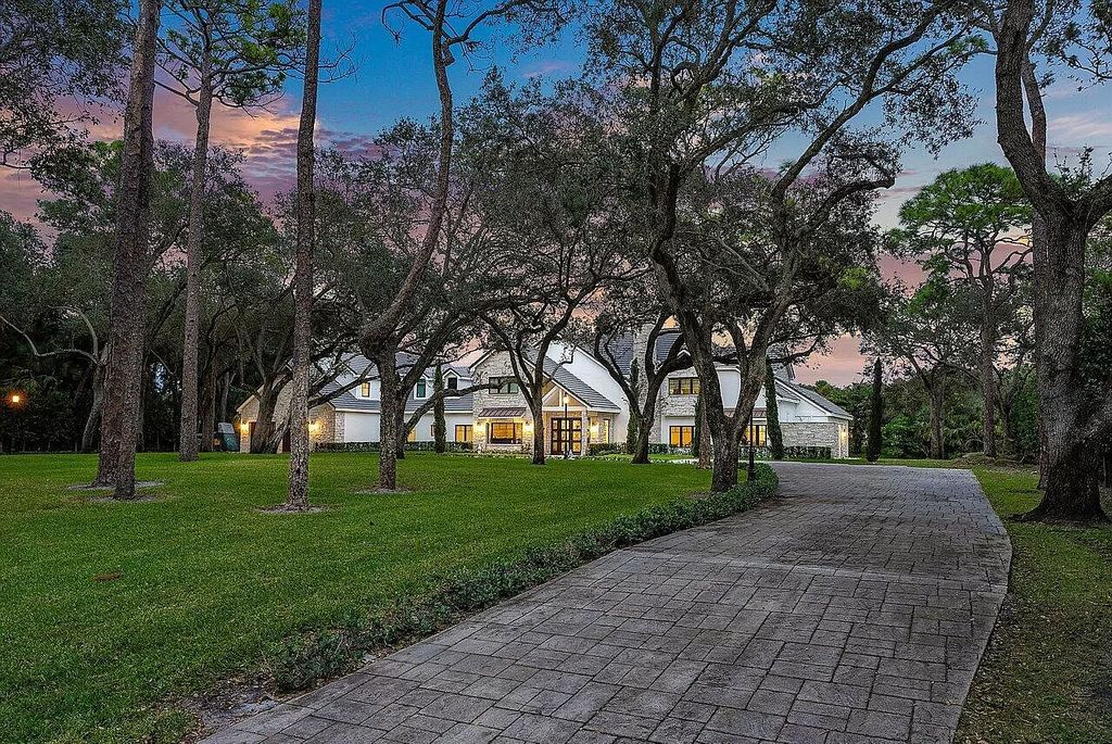 Unwind in unparalleled luxury at this breathtaking Delray Beach estate. Completely renovated with 8 bedrooms, 7.2 baths, and a guest house, this 12,000 sq ft paradise boasts resort-style pools, a spa, and Old World charm with modern amenities. Gourmet kitchen, home theater, billiards room, and air-conditioned 6-car garage. Minutes from beach, downtown, and top schools. Must see!