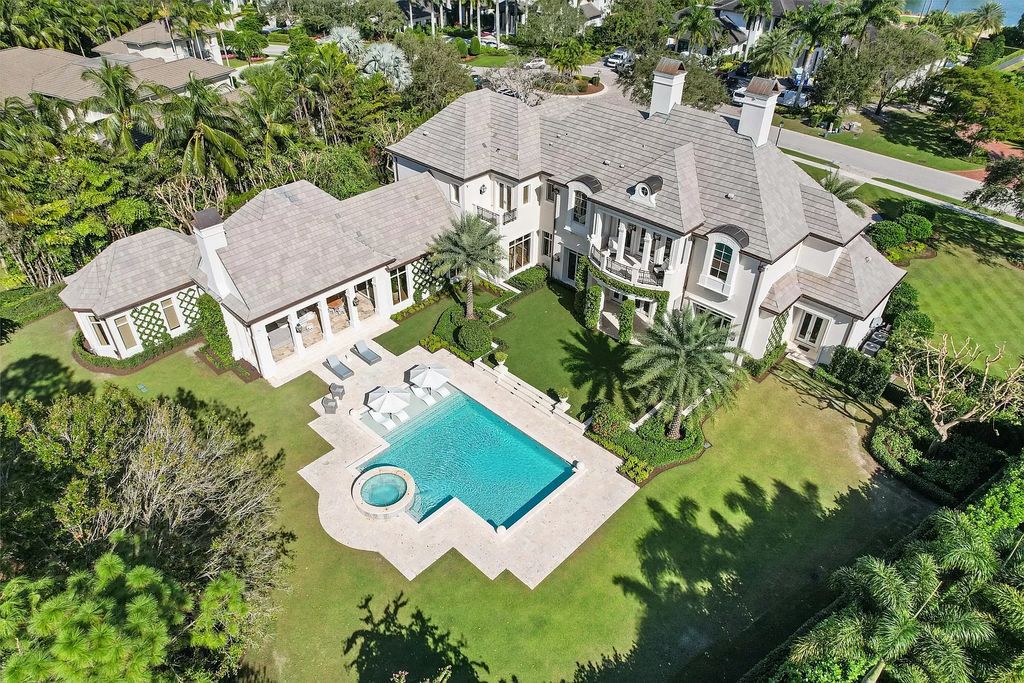 Palm Beach Gardens awaits with this European-style mansion. 5 bedrooms, spa, wine room, & resort-like amenities at your doorstep. Live the dream at Old Palm Golf Club. Membership included.