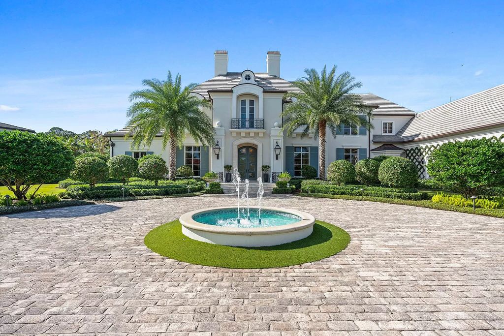 Palm Beach Gardens awaits with this European-style mansion. 5 bedrooms, spa, wine room, & resort-like amenities at your doorstep. Live the dream at Old Palm Golf Club. Membership included.