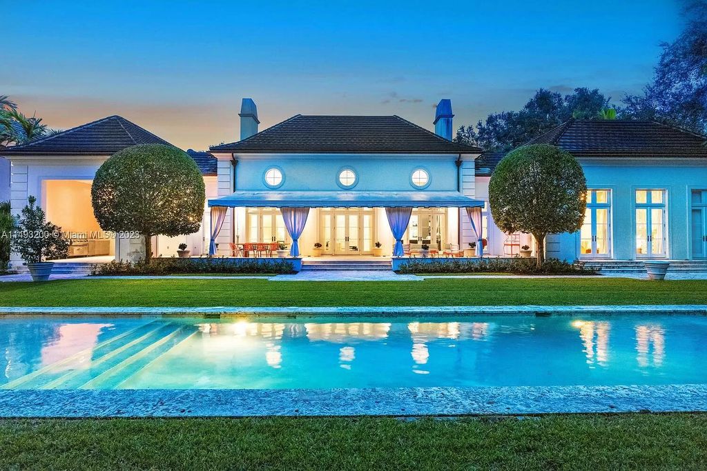 Experience the epitome of modern living in this custom-built French Provincial masterpiece. This exceptional residence offers a harmonious blend of indoor and outdoor living, providing a tranquil escape amidst lush gardens and a Hamptons-inspired oasis. With six bedrooms, six-and-a-half bathrooms, and an expansive 44,239-square-foot lot, this exceptional residence provides ample space for both grand gatherings and intimate moments of tranquility.