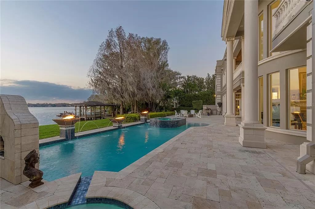 Own a piece of paradise! This custom-built lakefront estate boasts panoramic views, luxurious interiors, and unparalleled privacy on the exclusive Isle of Sicily. Enjoy chef's kitchen, spa-like master suite, resort-style pool and more!