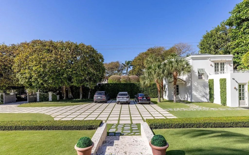 Immerse yourself in Palm Beach luxury at this stunning 1.3-acre estate! Featuring a private tennis court, 2 guest houses, & resort-style amenities like a pool, loggia, & pergola, this 7-bed, 8.5-bath masterpiece offers the ultimate in indoor & outdoor living. Grand living spaces, gourmet kitchen, & lavish master suite await. Don't miss this oasis!