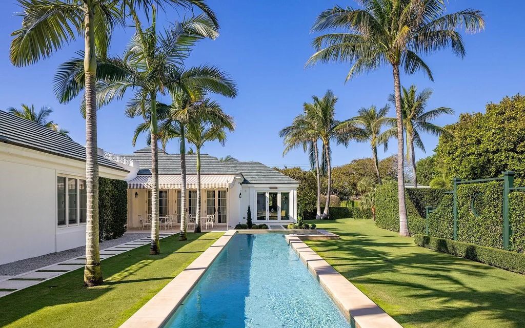 Immerse yourself in Palm Beach luxury at this stunning 1.3-acre estate! Featuring a private tennis court, 2 guest houses, & resort-style amenities like a pool, loggia, & pergola, this 7-bed, 8.5-bath masterpiece offers the ultimate in indoor & outdoor living. Grand living spaces, gourmet kitchen, & lavish master suite await. Don't miss this oasis!