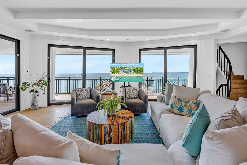 Wake up to waves lapping your private shore & breathtaking ocean views in this iconic Key Colony Beach retreat. 9 serene bedrooms, private pool, & endless entertainment space await in this coastal paradise. Luxury living redefined.