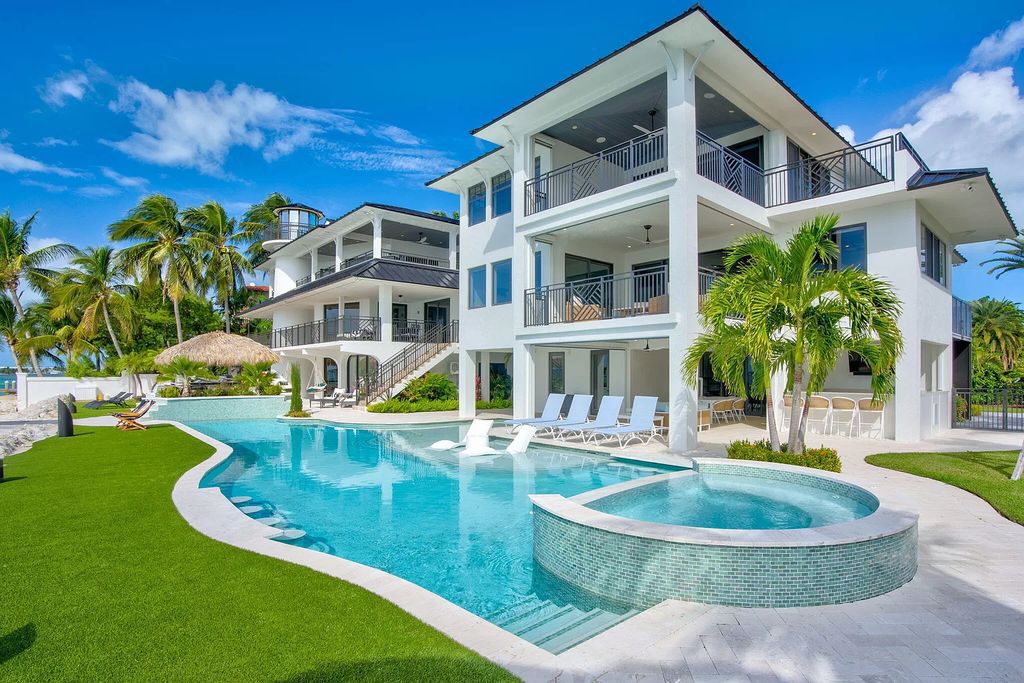 Wake up to waves lapping your private shore & breathtaking ocean views in this iconic Key Colony Beach retreat. 9 serene bedrooms, private pool, & endless entertainment space await in this coastal paradise. Luxury living redefined.