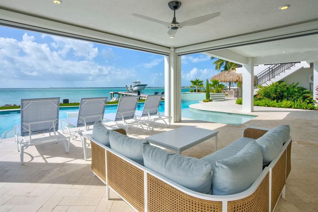 Wake up to waves lapping your private shore & breathtaking ocean views in this iconic Key Colony Beach retreat. 9 serene bedrooms, private pool, & endless entertainment space await in this coastal paradise. Luxury living redefined.