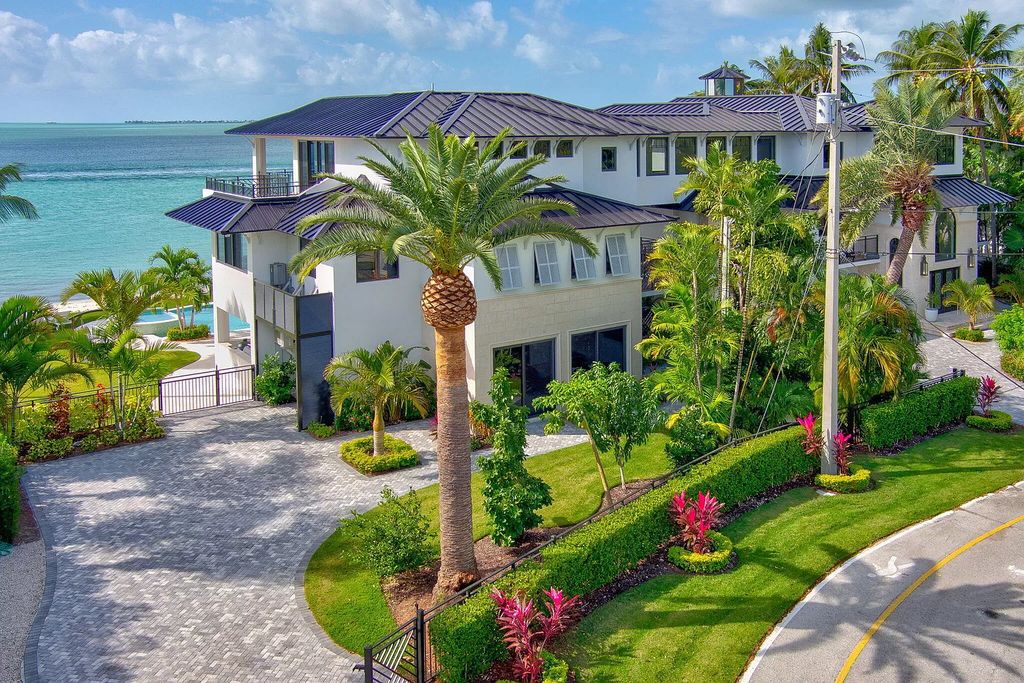 Wake up to waves lapping your private shore & breathtaking ocean views in this iconic Key Colony Beach retreat. 9 serene bedrooms, private pool, & endless entertainment space await in this coastal paradise. Luxury living redefined.