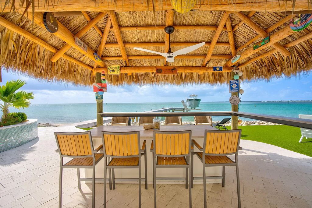 Wake up to waves lapping your private shore & breathtaking ocean views in this iconic Key Colony Beach retreat. 9 serene bedrooms, private pool, & endless entertainment space await in this coastal paradise. Luxury living redefined.