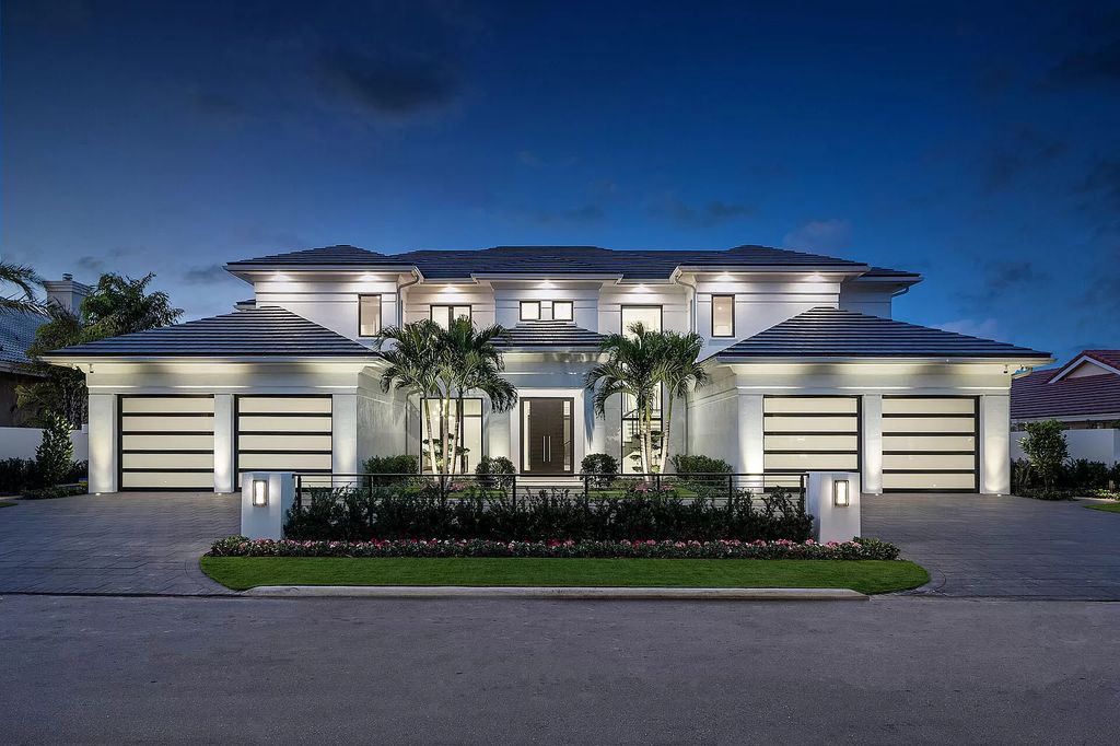 Set sail from your backyard in this custom 5-bedroom waterfront estate by SRD Building Corp. Luxurious living awaits with resort-style pool, dock, chef's kitchen, & smart home features. Explore 215 W Coconut Palm Rd, Boca Raton.