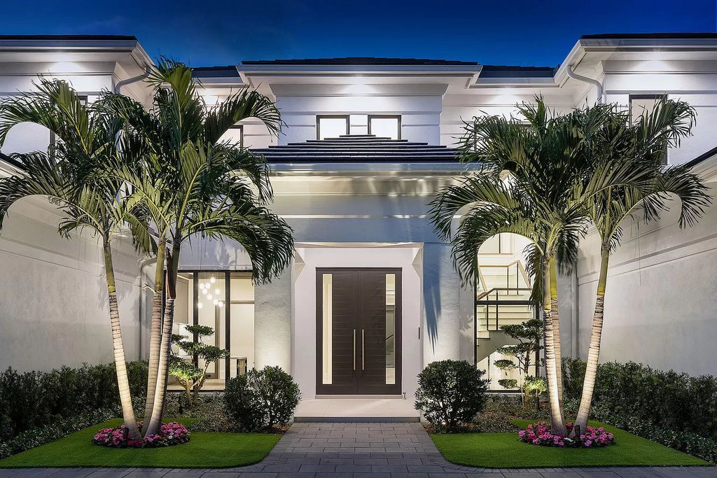 Set sail from your backyard in this custom 5-bedroom waterfront estate by SRD Building Corp. Luxurious living awaits with resort-style pool, dock, chef's kitchen, & smart home features. Explore 215 W Coconut Palm Rd, Boca Raton.