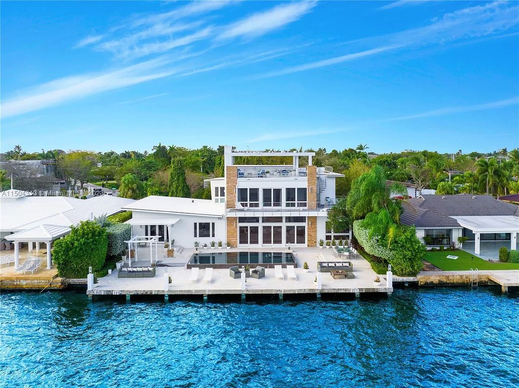 Step into a mid-century dream! This Fort Lauderdale estate boasts soaring ceilings, infinity pool & Intracoastal vistas. Master suite sanctuary, rooftop fireplace, potential expansion - experience Florida luxury redefined. 2110 Intracoastal Dr awaits.