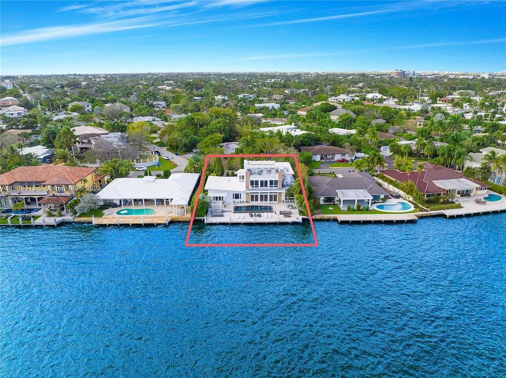 Step into a mid-century dream! This Fort Lauderdale estate boasts soaring ceilings, infinity pool & Intracoastal vistas. Master suite sanctuary, rooftop fireplace, potential expansion - experience Florida luxury redefined. 2110 Intracoastal Dr awaits.