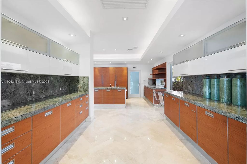 Step into a mid-century dream! This Fort Lauderdale estate boasts soaring ceilings, infinity pool & Intracoastal vistas. Master suite sanctuary, rooftop fireplace, potential expansion - experience Florida luxury redefined. 2110 Intracoastal Dr awaits.