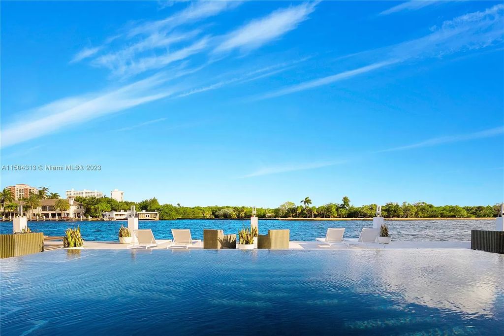 Step into a mid-century dream! This Fort Lauderdale estate boasts soaring ceilings, infinity pool & Intracoastal vistas. Master suite sanctuary, rooftop fireplace, potential expansion - experience Florida luxury redefined. 2110 Intracoastal Dr awaits.