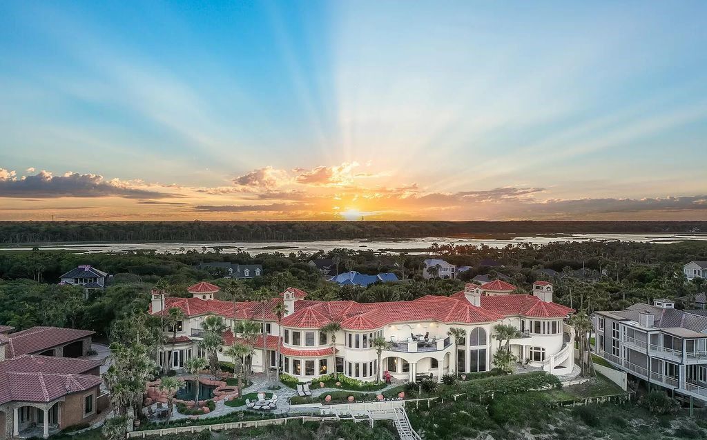 Experience unparalleled luxury at 1263 Ponte Vedra Blvd. This 12,751 sq ft custom estate boasts 200' ocean frontage, panoramic sunrise views, 6 ensuite bedrooms, a private beach, lagoon pool, gym, wine cellar, & more. Minutes from dining, shopping, & exclusive clubs.