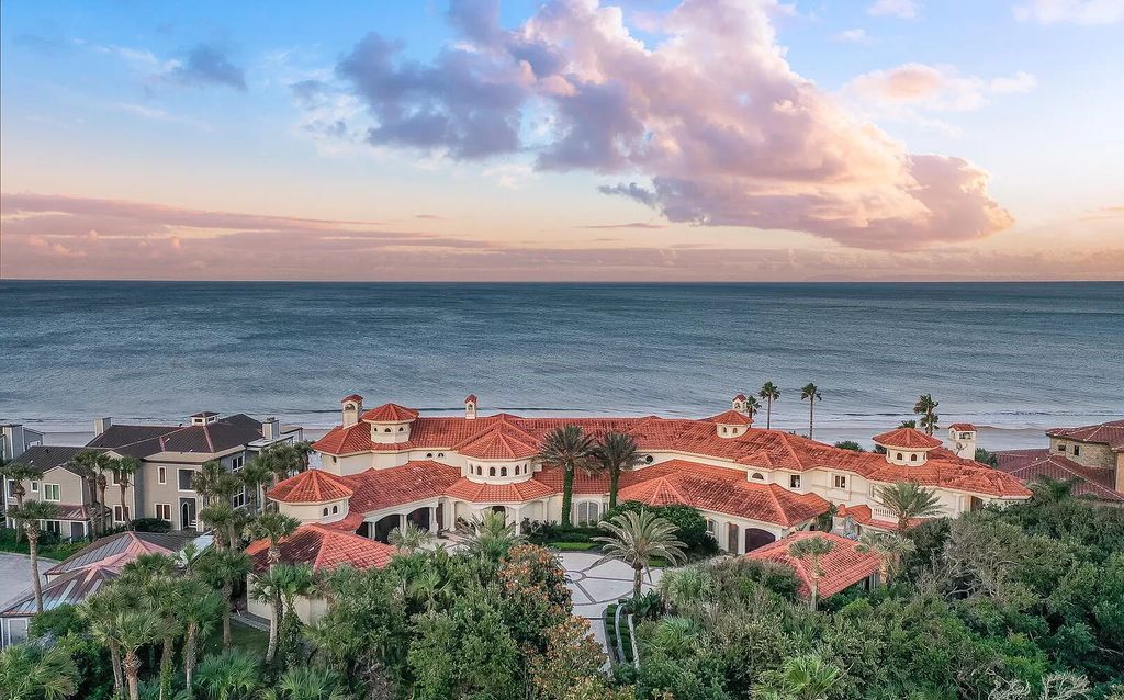 Experience unparalleled luxury at 1263 Ponte Vedra Blvd. This 12,751 sq ft custom estate boasts 200' ocean frontage, panoramic sunrise views, 6 ensuite bedrooms, a private beach, lagoon pool, gym, wine cellar, & more. Minutes from dining, shopping, & exclusive clubs.