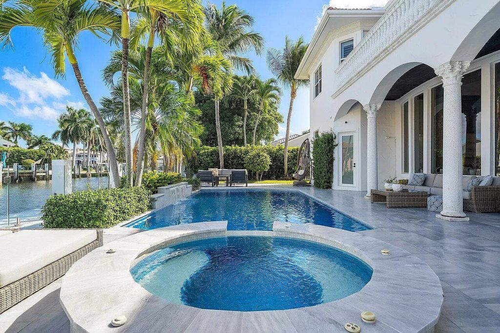 Experience the epitome of luxury living in this meticulously renovated 5-bedroom, 5.1-bathroom Delray Beach estate, boasting over 7,700 square feet of exquisite living space. Nestled within the prestigious waterfront community of Tropic Isle, this turnkey home is positioned on 100' of prime waterfront, offering unparalleled Intracoastal views and an unparalleled living experience.