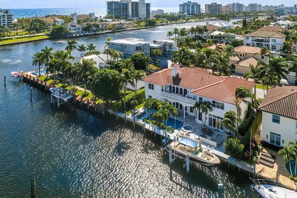 Experience the epitome of luxury living in this meticulously renovated 5-bedroom, 5.1-bathroom Delray Beach estate, boasting over 7,700 square feet of exquisite living space. Nestled within the prestigious waterfront community of Tropic Isle, this turnkey home is positioned on 100' of prime waterfront, offering unparalleled Intracoastal views and an unparalleled living experience.