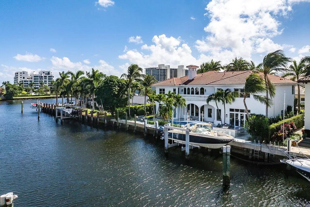 Experience the epitome of luxury living in this meticulously renovated 5-bedroom, 5.1-bathroom Delray Beach estate, boasting over 7,700 square feet of exquisite living space. Nestled within the prestigious waterfront community of Tropic Isle, this turnkey home is positioned on 100' of prime waterfront, offering unparalleled Intracoastal views and an unparalleled living experience.