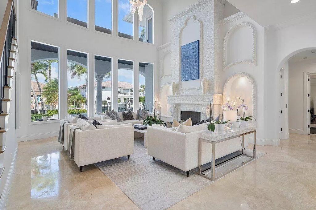 Experience the epitome of luxury living in this meticulously renovated 5-bedroom, 5.1-bathroom Delray Beach estate, boasting over 7,700 square feet of exquisite living space. Nestled within the prestigious waterfront community of Tropic Isle, this turnkey home is positioned on 100' of prime waterfront, offering unparalleled Intracoastal views and an unparalleled living experience.