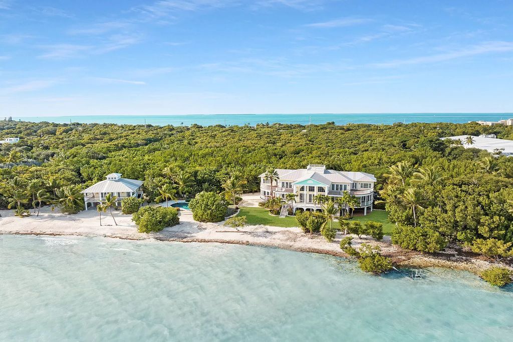 Escape to your own slice of paradise at this exquisite oceanfront estate in Islamorada. 450 feet of private beachfront, 8+ acres, heated pool and stunning Atlantic views - island living redefined!