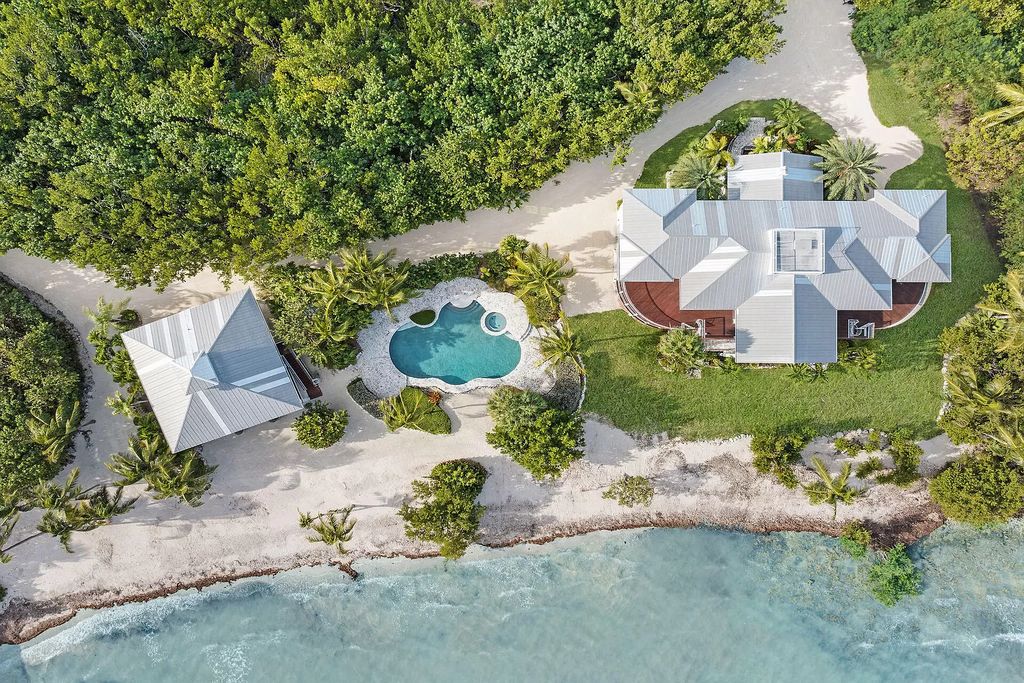 Escape to your own slice of paradise at this exquisite oceanfront estate in Islamorada. 450 feet of private beachfront, 8+ acres, heated pool and stunning Atlantic views - island living redefined!