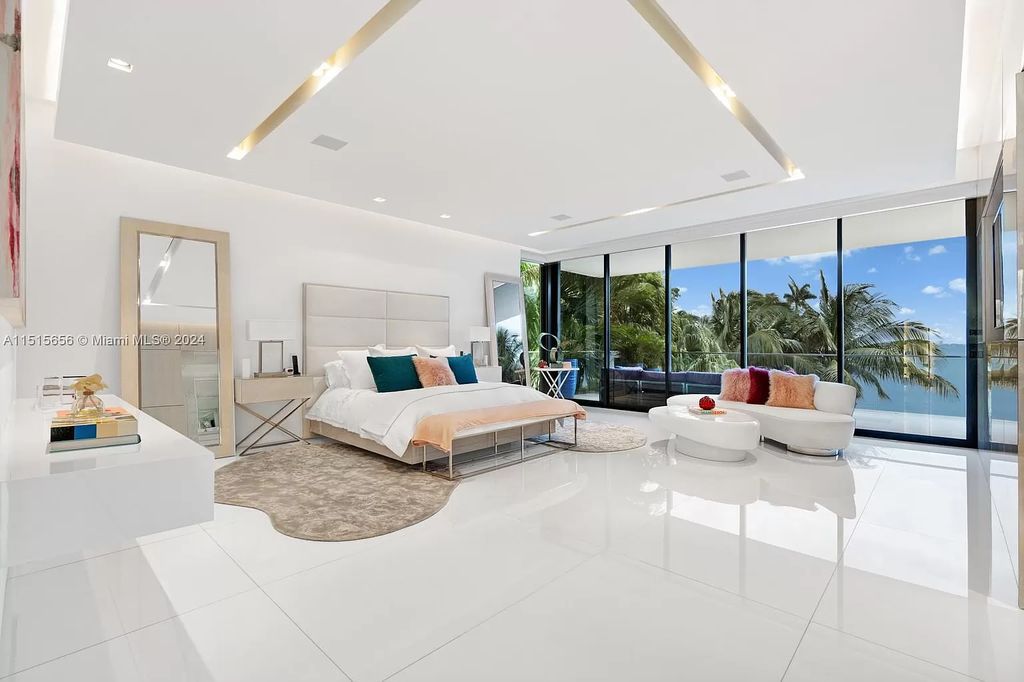 Discover elegance in this $42.5 million contemporary masterpiece by Jennifer Post on North Bay Road, Miami Beach. Atrium courtyard, infinity edge pool, rooftop pool, and a private dock with 105 feet of water frontage offer luxury living with breathtaking views.