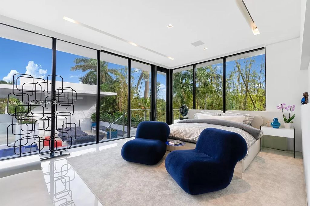 Discover elegance in this $42.5 million contemporary masterpiece by Jennifer Post on North Bay Road, Miami Beach. Atrium courtyard, infinity edge pool, rooftop pool, and a private dock with 105 feet of water frontage offer luxury living with breathtaking views.